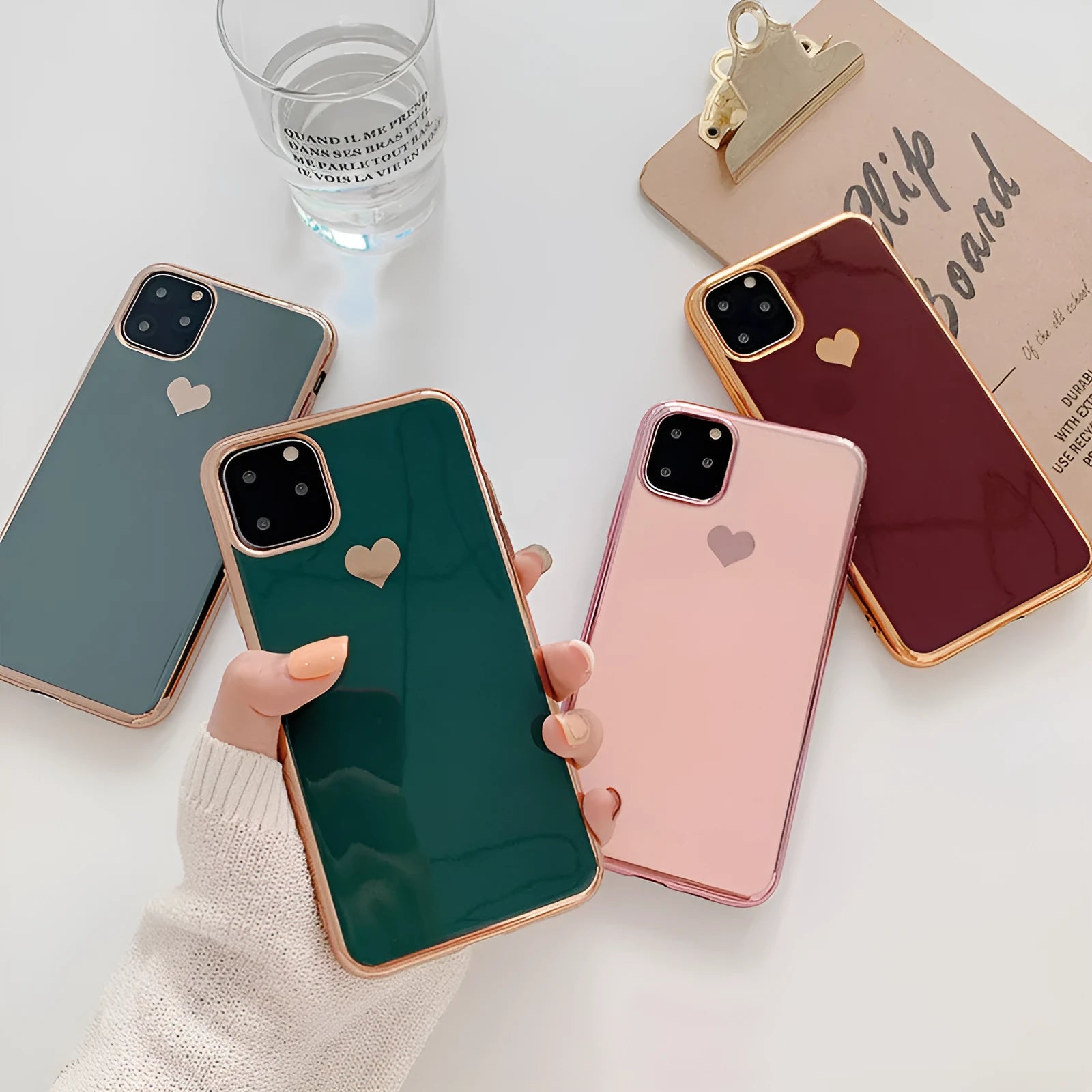 Simple solid colour TPU back cover case for iPhone on a table, shown in blue.