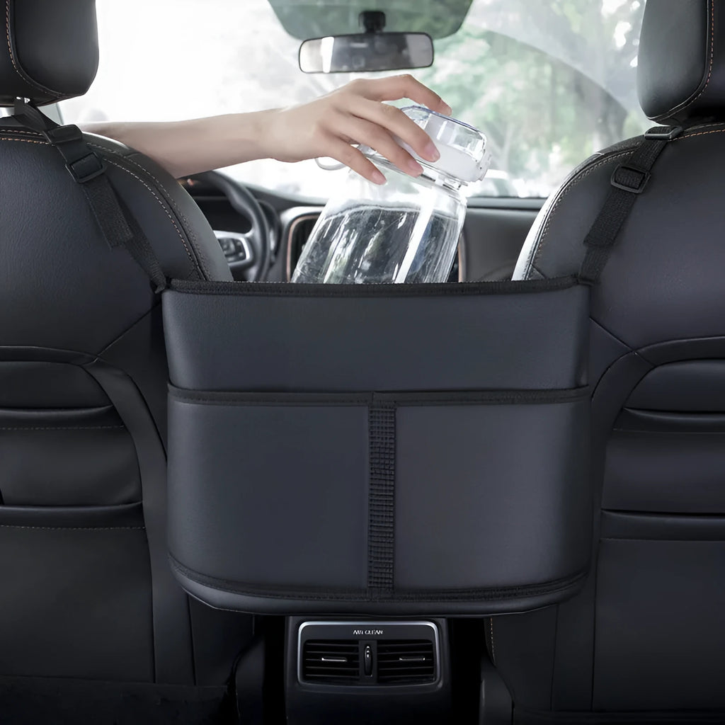 Black leather car seat net pocket with sports carbon fibre pattern hanging in middle of seat