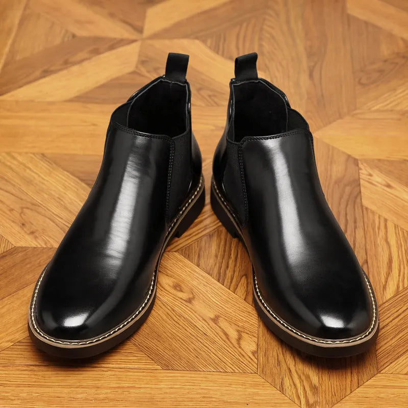 Black and brown formal pointed-toe leather boots with square heel and rubber sole.