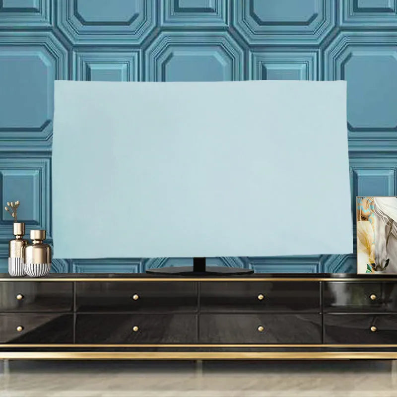 Pink velvet fabric cover draped over a large flat-screen television.