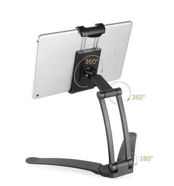 Silver aluminium alloy desktop tablet stand holding a tablet, showing 360-degree rotation adjustment.