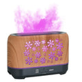 Colourful snowflake wood grain aromatherapy humidifier with flame effect lighting on a desktop