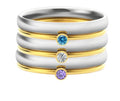 December birthstone titanium steel ring with geometric design and electroplated gold and steel finishes.