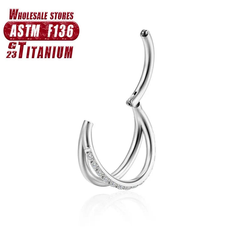 Titanium alloy fork nose ring for body piercing in silver colour on a grey background.