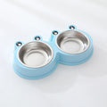 A stainless steel pet bowl with two compartments for water and food, shown in blue.