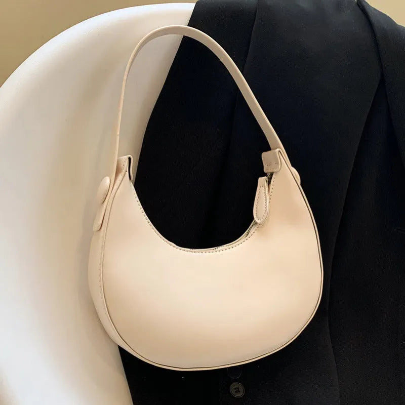 Women's retro dumpling-shaped shoulder bag in PU leather with a sandwich pocket.
