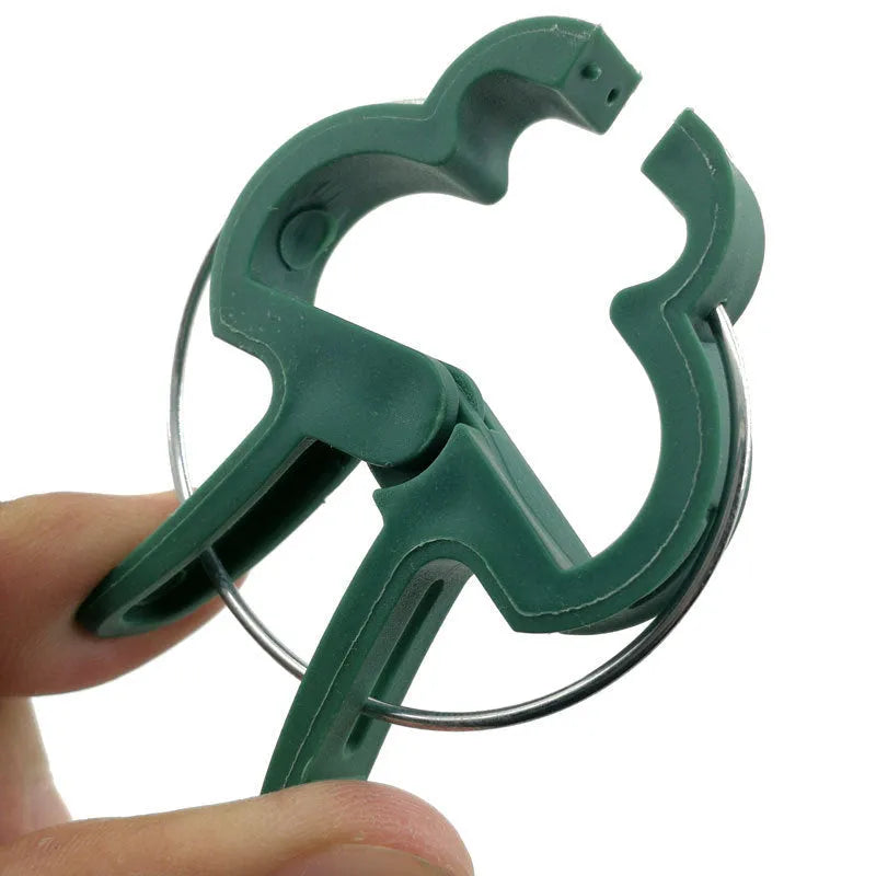 Green plastic and zinc plant fixing clips in large and small sizes for climbing vegetables