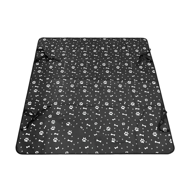Dog car seat protector mat on rear bench seats in grey dog footprints pattern