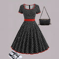 Women's polka dot pleated dress with square collar and front zipper closure in multicolour pattern