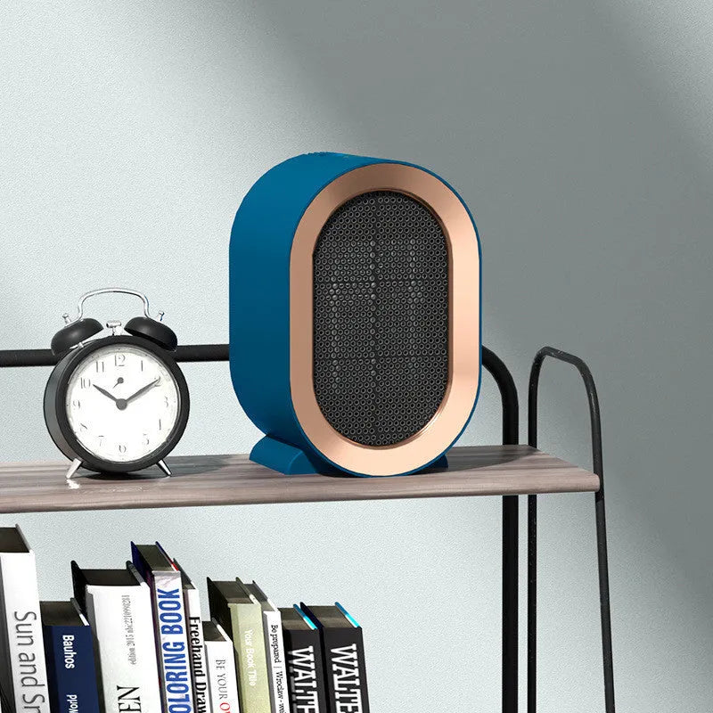 Desktop ceramic fan heater in black with mechanical control knobs and a front grille.