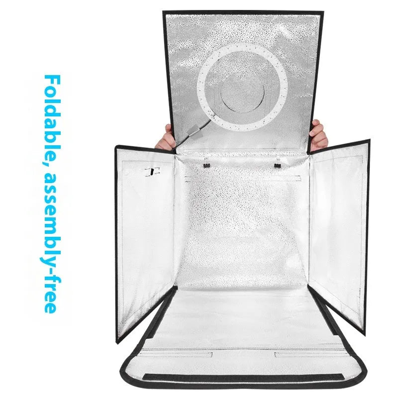 Foldable 50cm studio photo light box with integrated three-colour LED panel and reflective cloth interior.