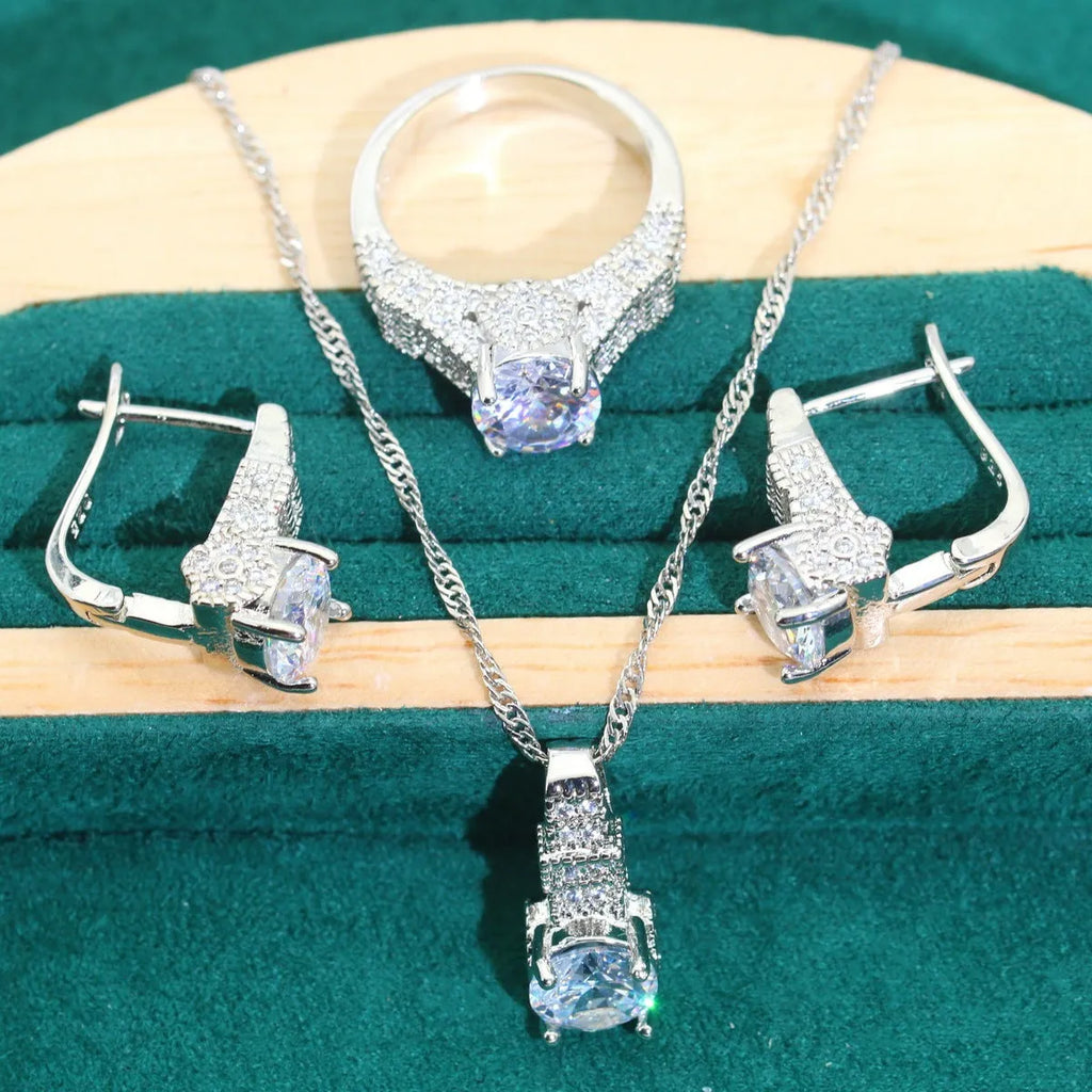 Four-piece bridal jewellery set with necklace, bracelet, earrings, and ring in alloy with zircon detail