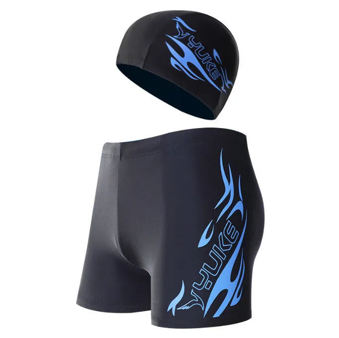 Men's plus size blue fire print swimming trunks and matching swim cap on black background.