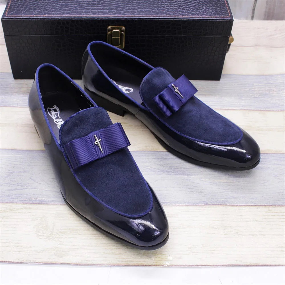 Men's black patent leather low-top shoes with a gold tassel detail and rubber sole.