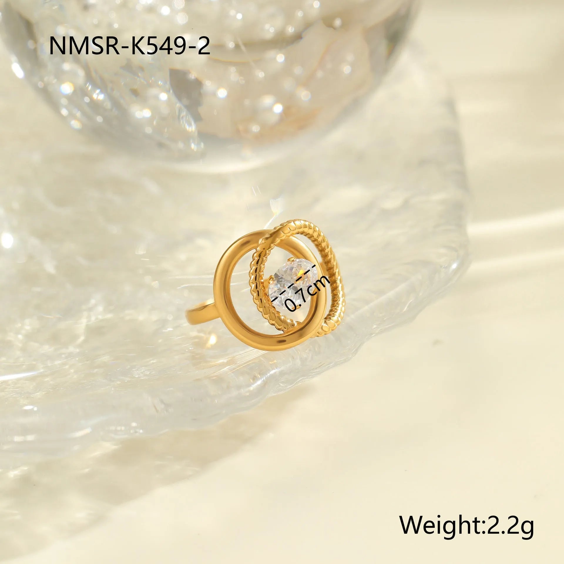 Gold-coloured stainless steel open ring with zircon stones in a geometric heart design.