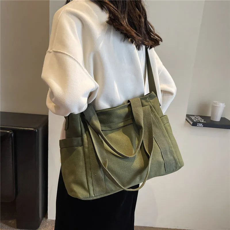 Women's polyester canvas shoulder bag with large capacity and mobile phone pocket in solid colour