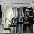 Women's loose fit knit cardigan, vest, and casual pants three-piece set in a solid colour.