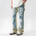 Retro yellow and blue patchwork jeans with splash-ink damaged design showing front and back views