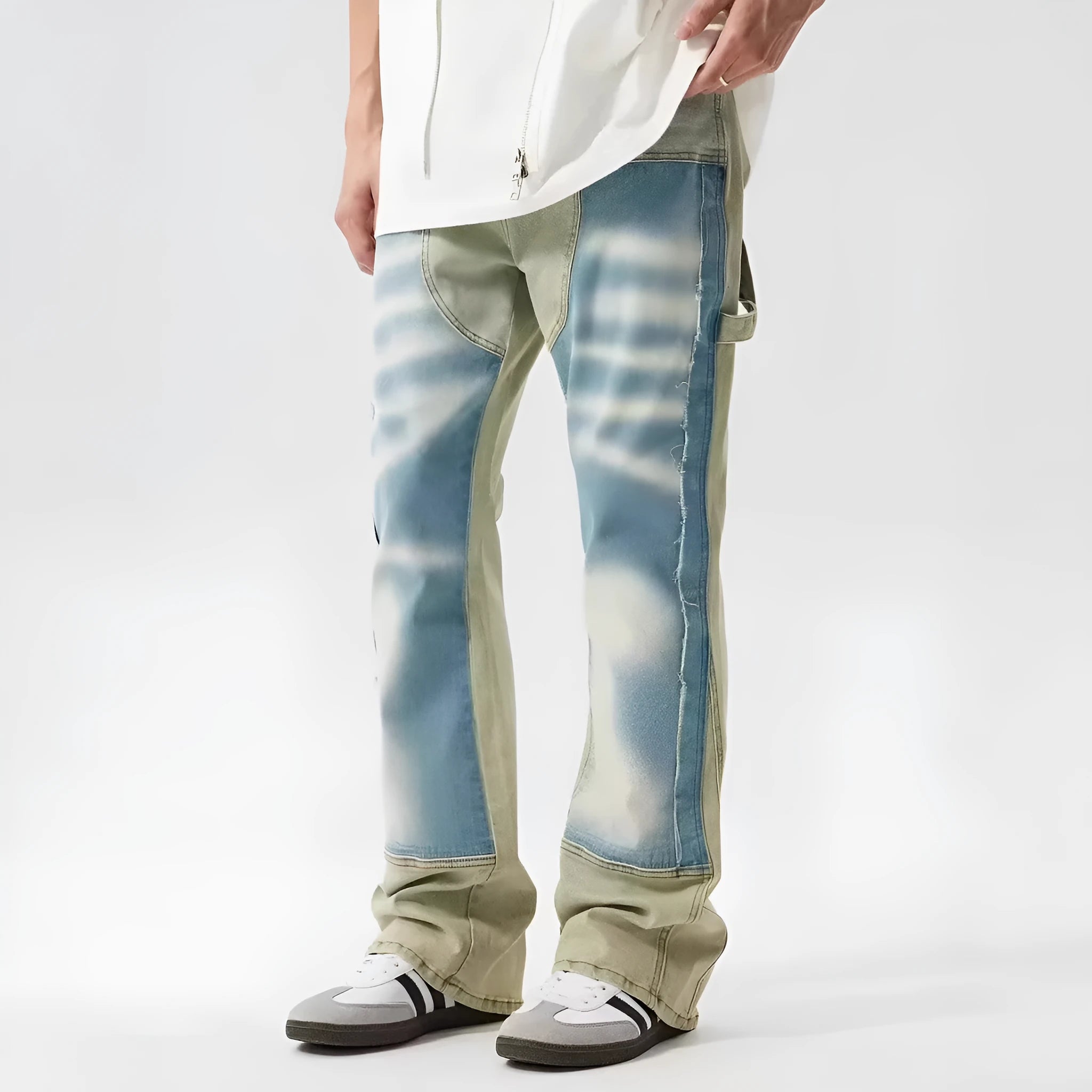 Retro yellow and blue patchwork jeans with splash-ink damaged design showing front and back views