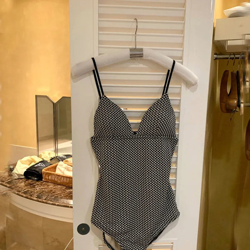 Blue one-piece swimsuit for women with a small chest and thin build on a mannequin.