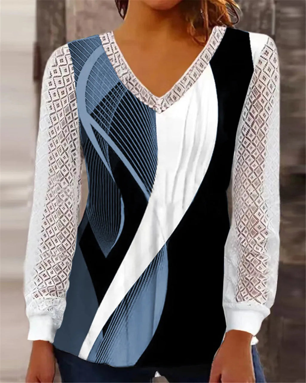 Purple v-neck loose lace top with hollow-out pattern and long sleeves on hanger