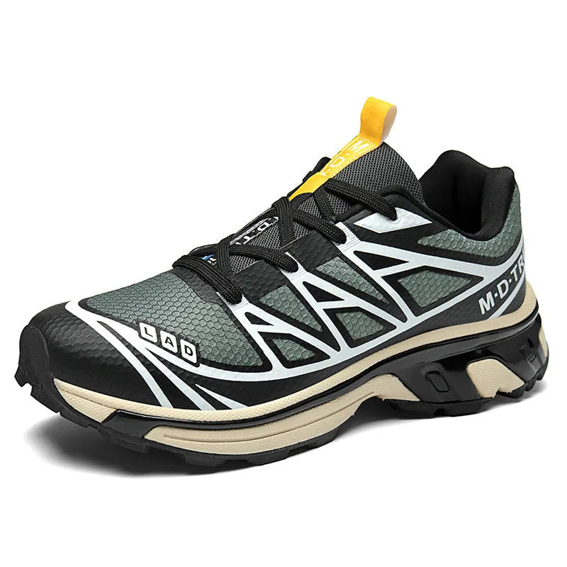 Low-top hiking shoes in khaki with rubber soles and front lace-up closure.