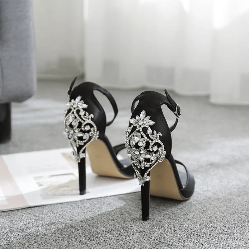 Black suede women's high heel shoes with rhinestone decoration and a fish mouth toe opening.