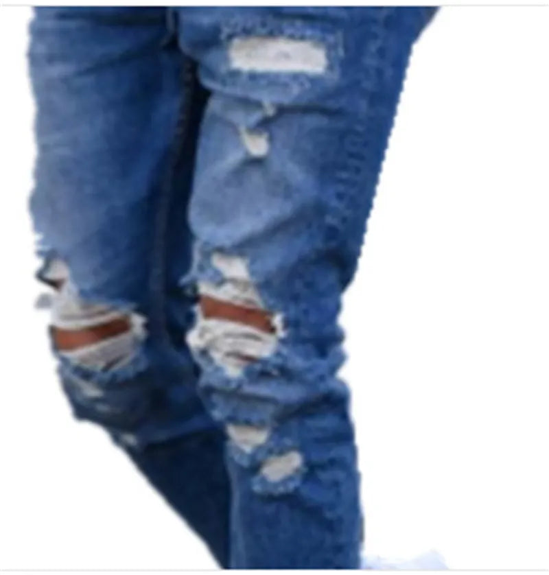 Men's deep blue cotton hole jeans laid flat, showing distressed detail and button fly.