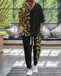 Cropped sleeve V-neck trousers suit set in thin polyester fabric on a hanger.