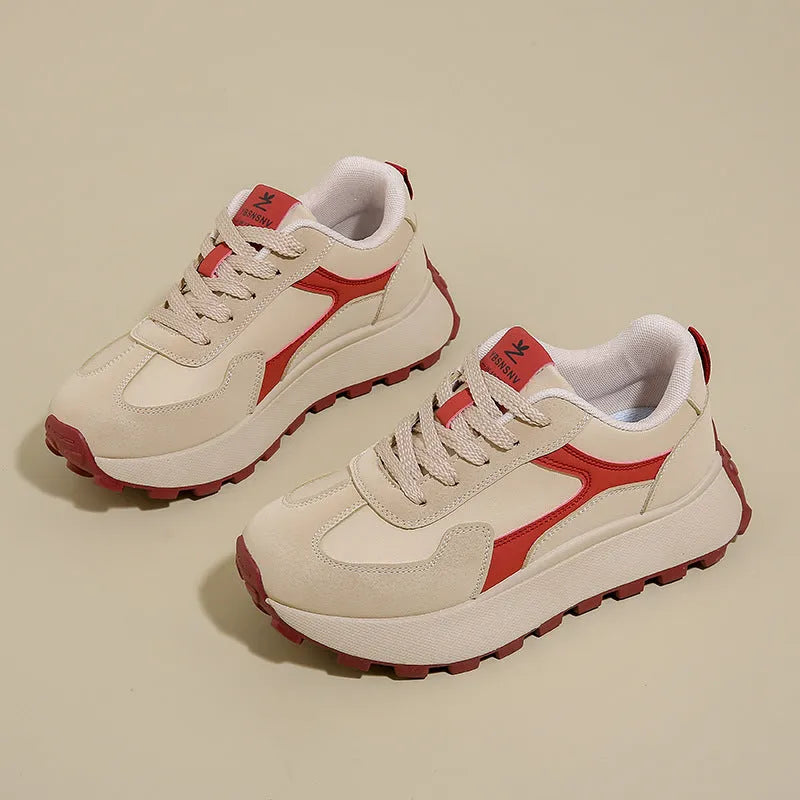 Women's low-top platform sports shoes in solid colours with lace-up front and mesh lining.