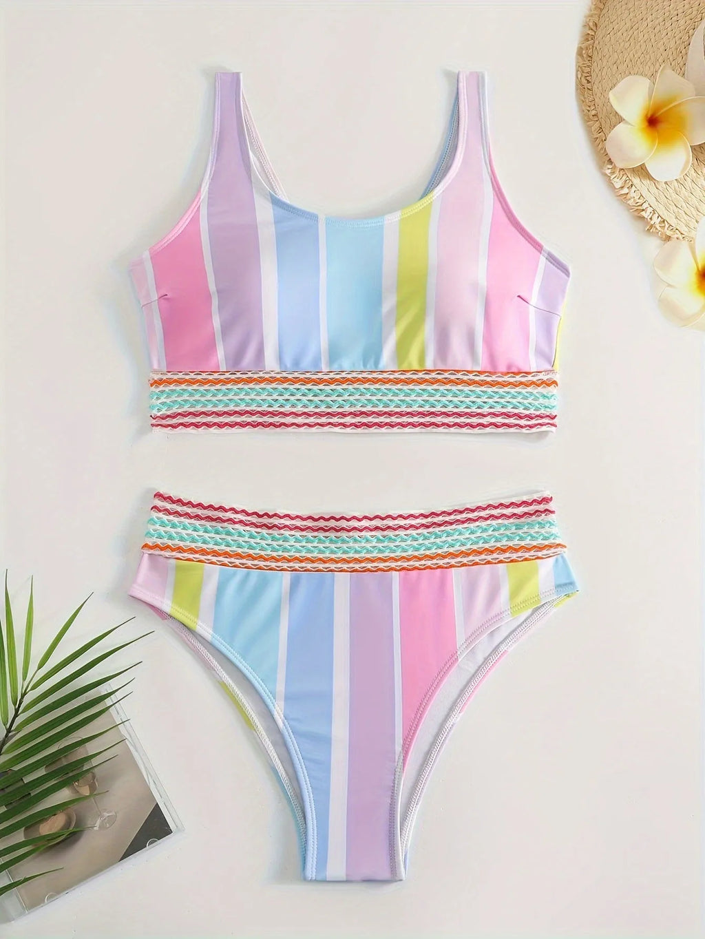Women's striped two-piece sports bikini swimwear set on a mannequin.