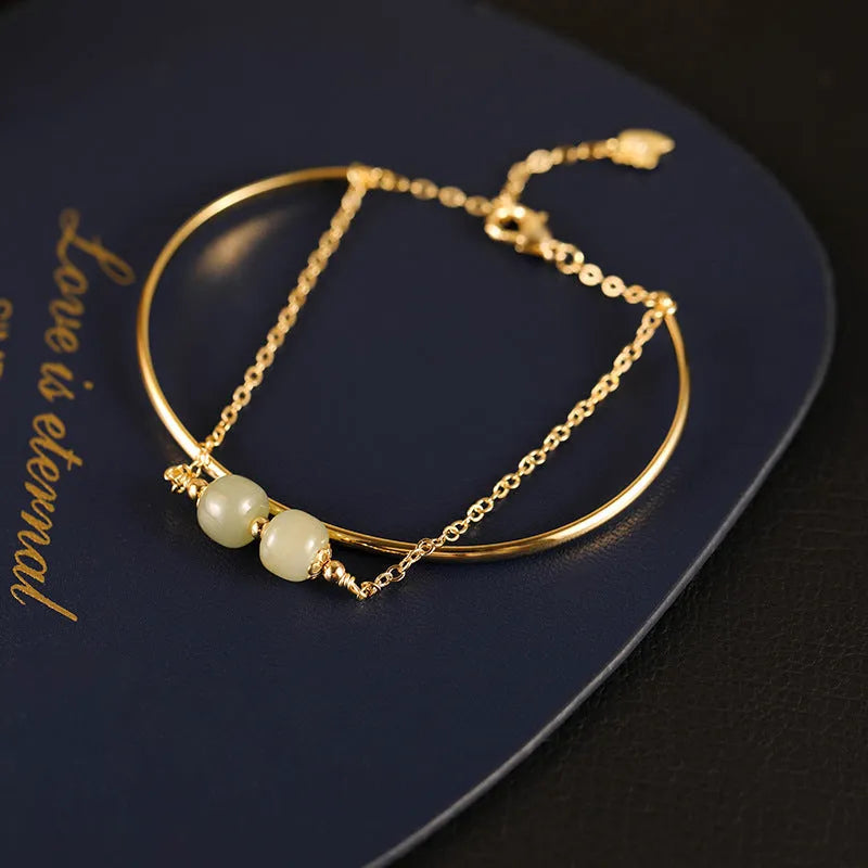 Women's Hetian jade bracelet with gold inlay detail, shown in single, double, and three bead versions.