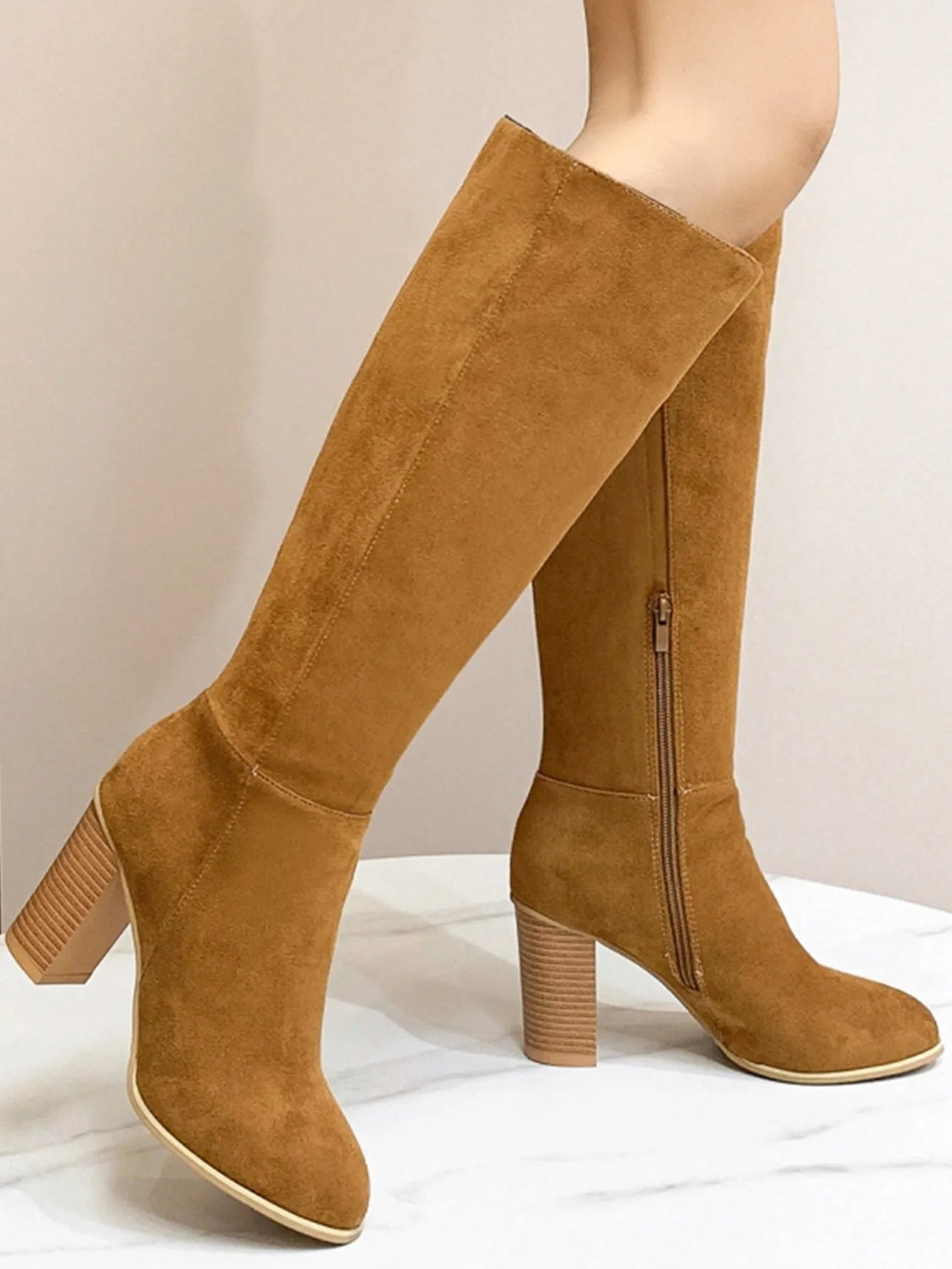 Women's black square toe high heel fashion boots made from synthetic PU material.