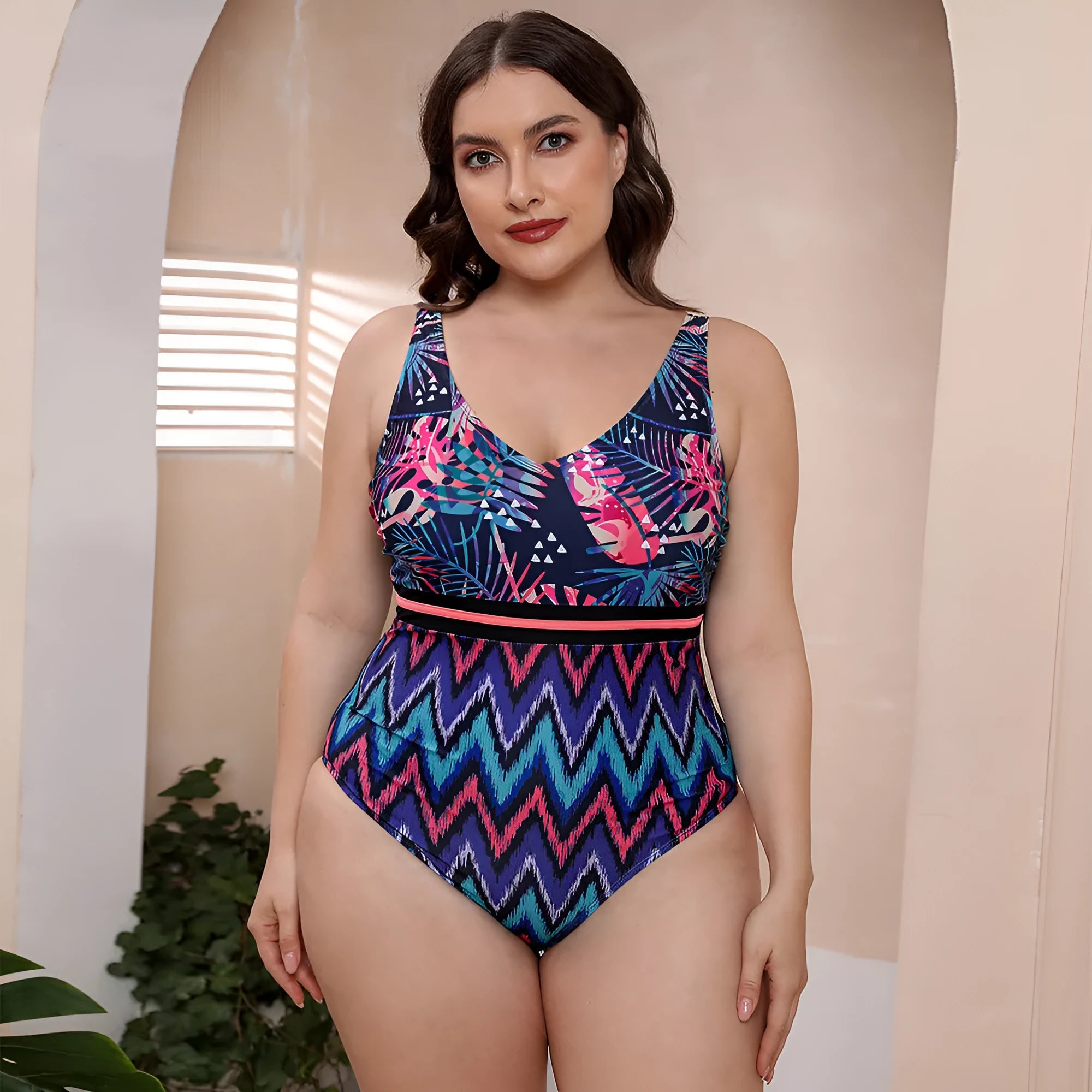 Blue printed spaghetti strap one-piece swimsuit with a striped vest design on a mannequin.