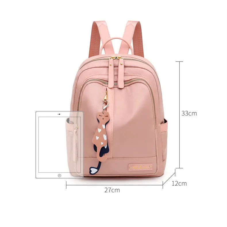 Women's black nylon casual backpack with double shoulder straps showing three-dimensional outer pockets