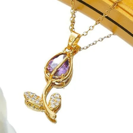 Gold electroplated titanium steel tulip necklace with adjustable chain and floral pendant
