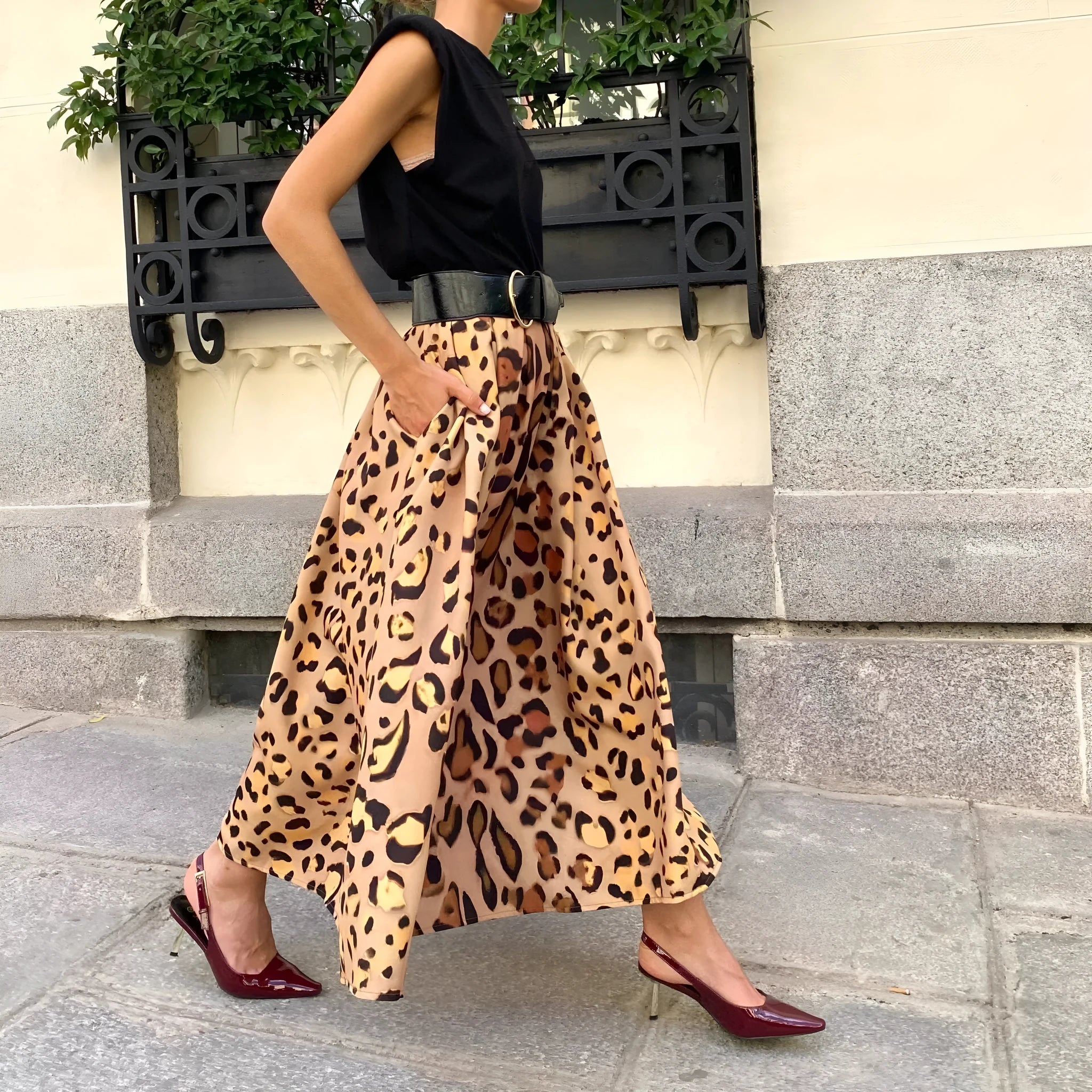 Brown leopard print women's A-line long skirt with big hem design shown in socialite styling