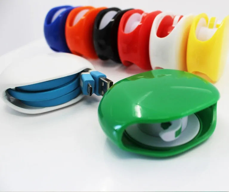Automatic earphone retractor winder in black with extended cable showing push-type mechanism