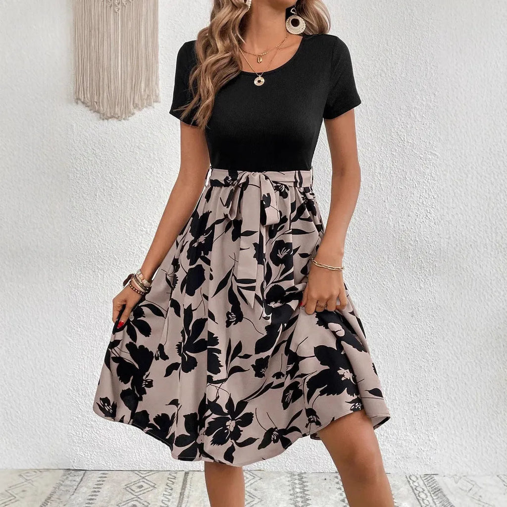 Women's khaki floral print A-line dress with shoulder strap detailing on hanger