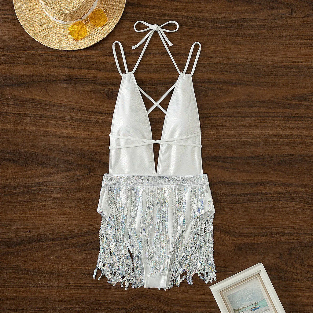 White deep V-neck one-piece swimsuit with tassel detailing and sleeveless design