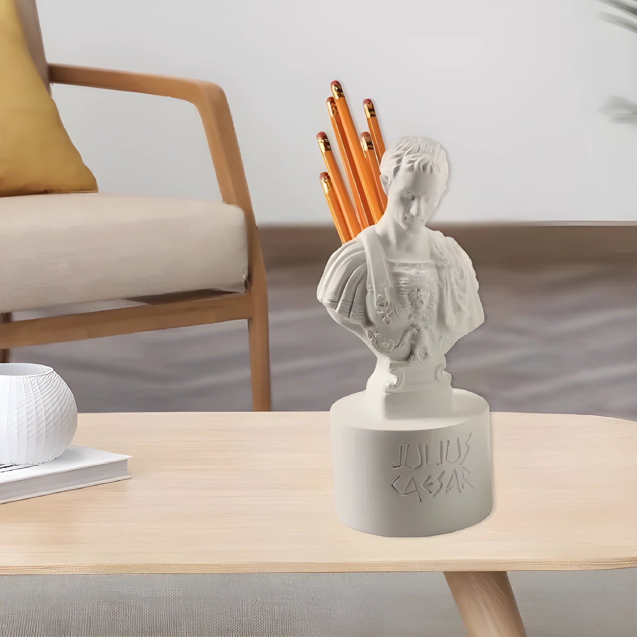 White synthetic resin pen holder with sculpted American creative character design on a desk.