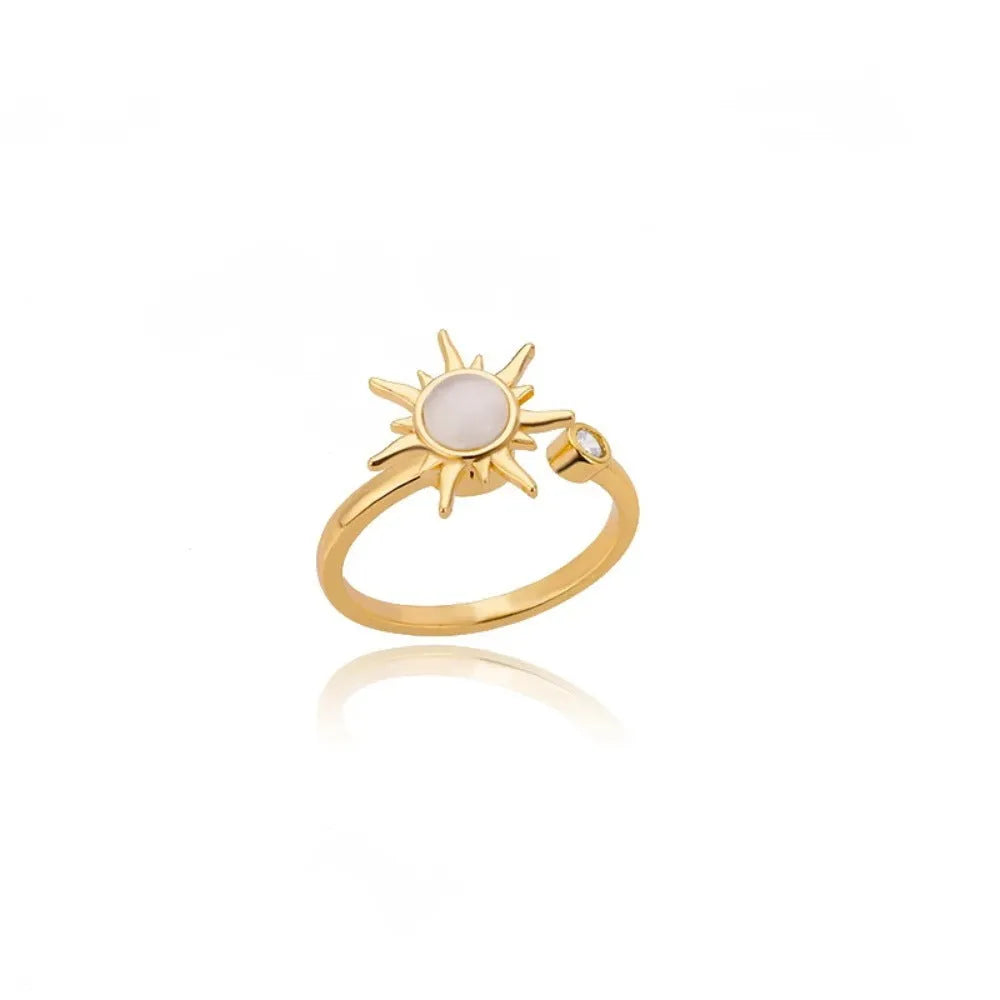 Rotatable decompression ring with adjustable opening in gold electroplated finish