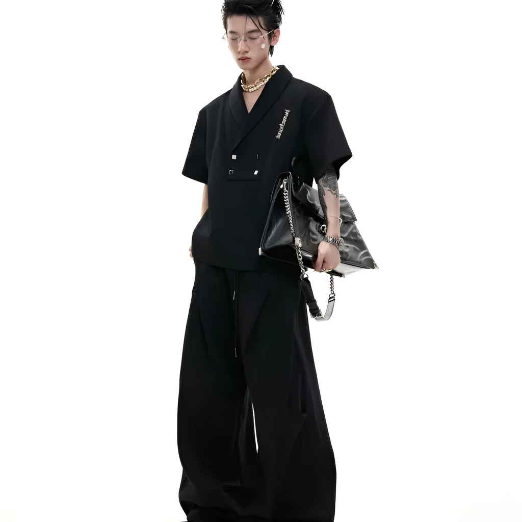 Men's dark grey cotton V-neck sports suit with padded shoulder short sleeve jacket and matching shorts.
