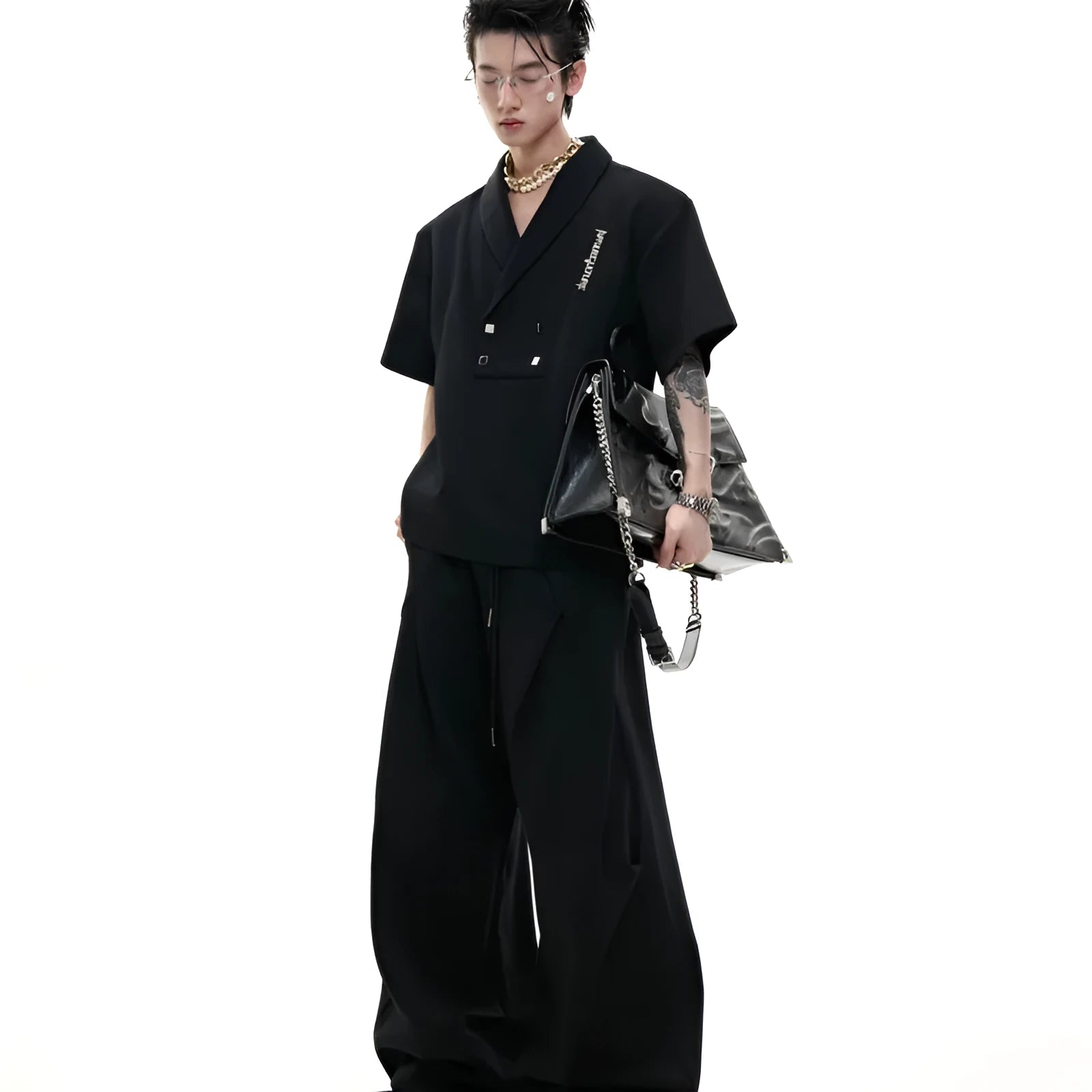 Men's dark grey cotton V-neck sports suit with padded shoulder short sleeve jacket and matching shorts.