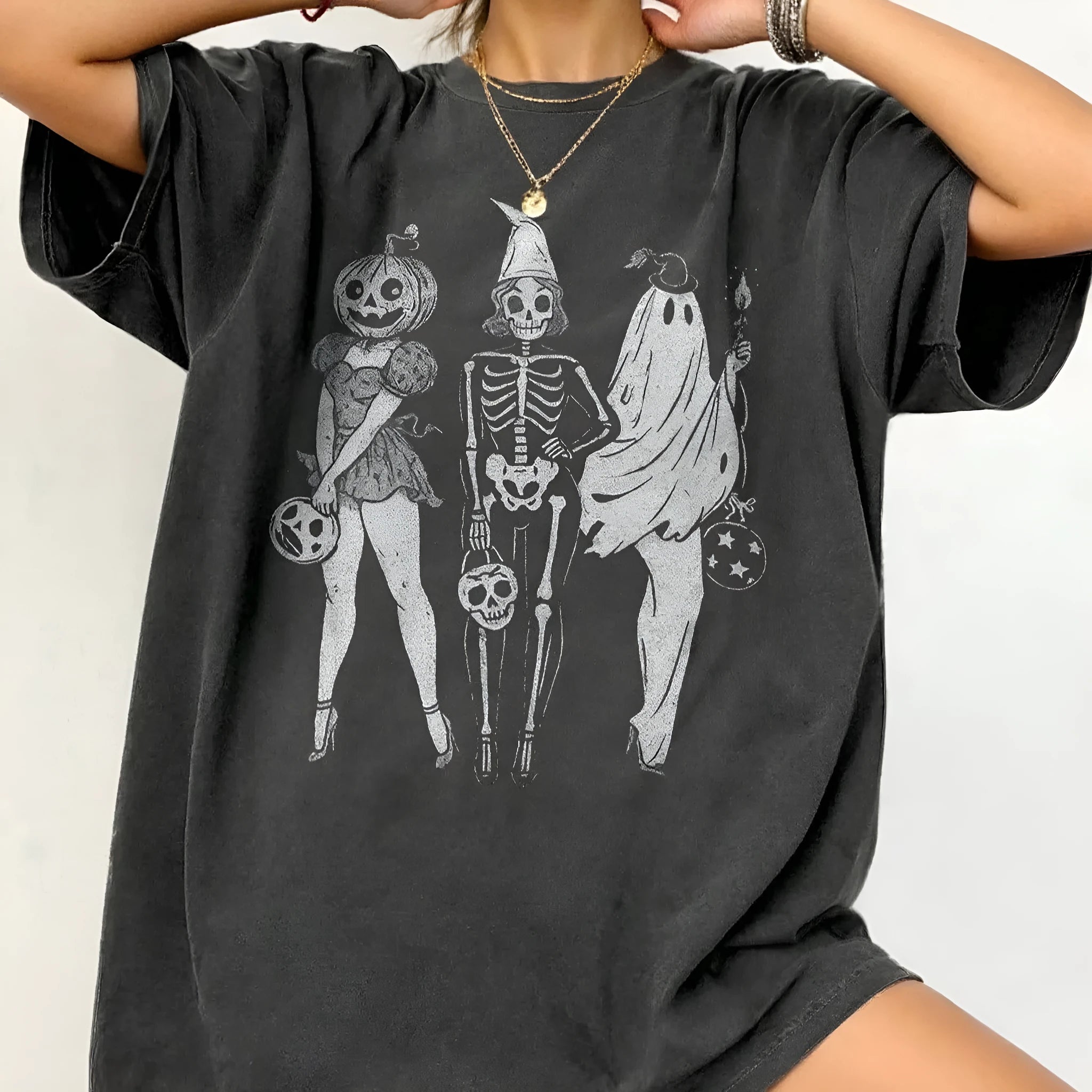 Loose fit cotton short sleeve T-shirt in black, green, grey, or orange on a hanger