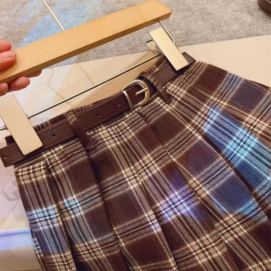 Girls' plaid pleated A-line skirt made from cotton blend fabric with a full lining.