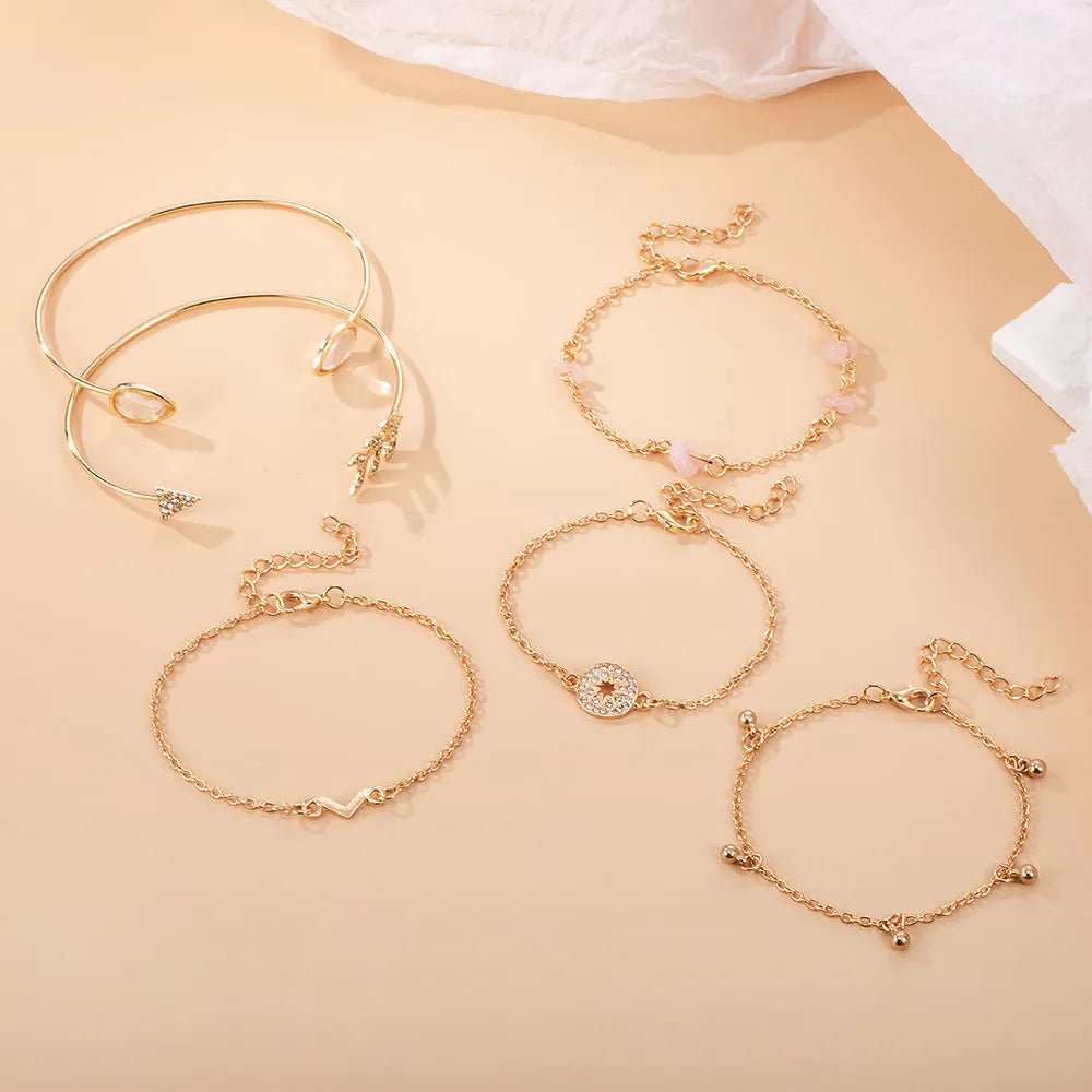 Six golden bracelets with spot drill, arrow, water drop and V-shaped pendants on zinc alloy chains