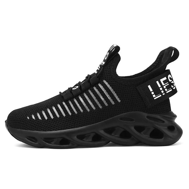 Child's black coconut sneaker with Velcro strap on a fabric upper and light EVA sole