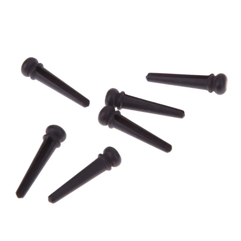 Set of six matt black ebony guitar string nails with 5.3mm bayonet diameter.
