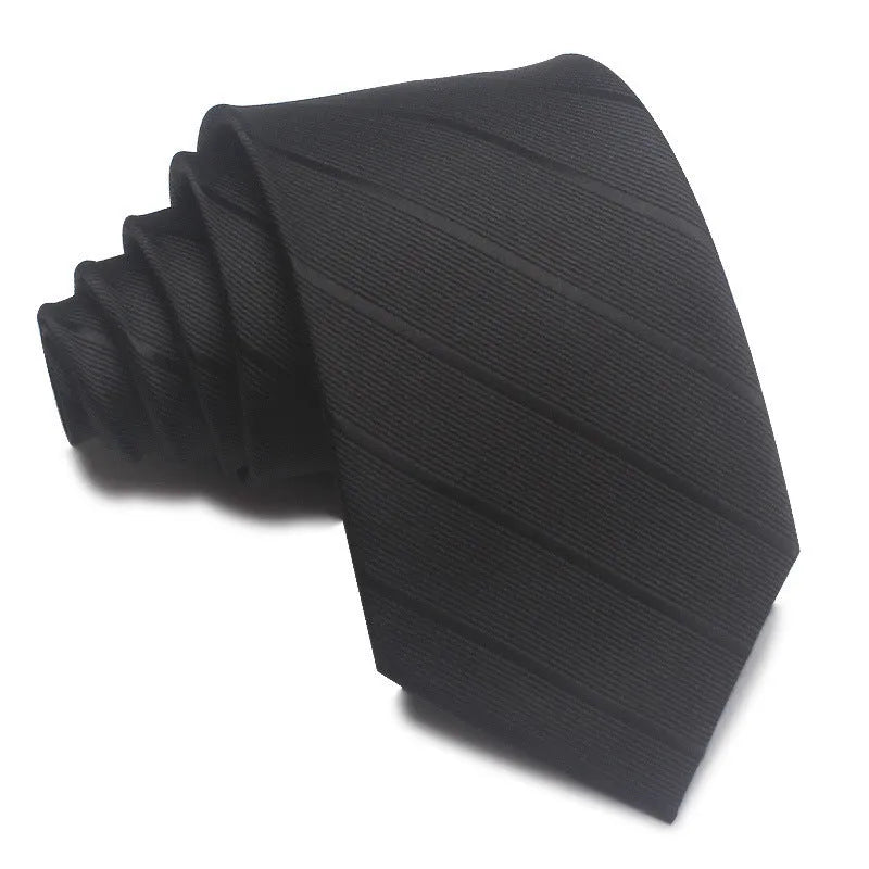 Close-up of a red, black, and blue striped men's formal tie with a textured Jacquard weave.